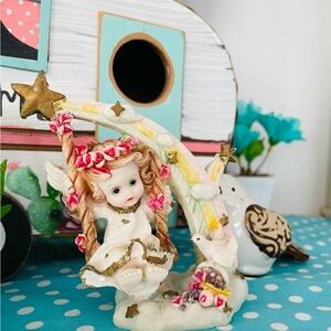 6x$15. Charming Angel Figurine with Floral Accents